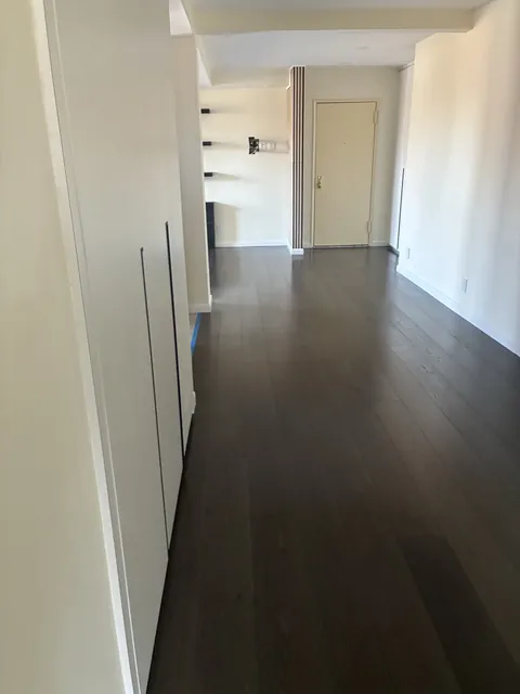 Hallway with wide-plank floors