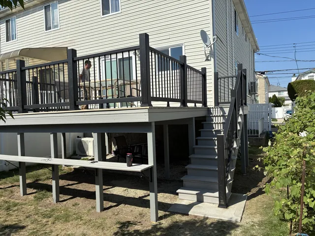 Raised composite deck with black railings