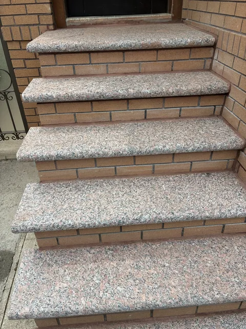 Rebuilt front steps with granite-look treads