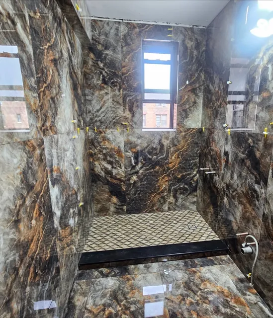 Luxury shower in gold-veined tile