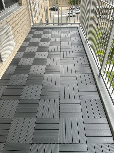 Balcony with modular deck tiles